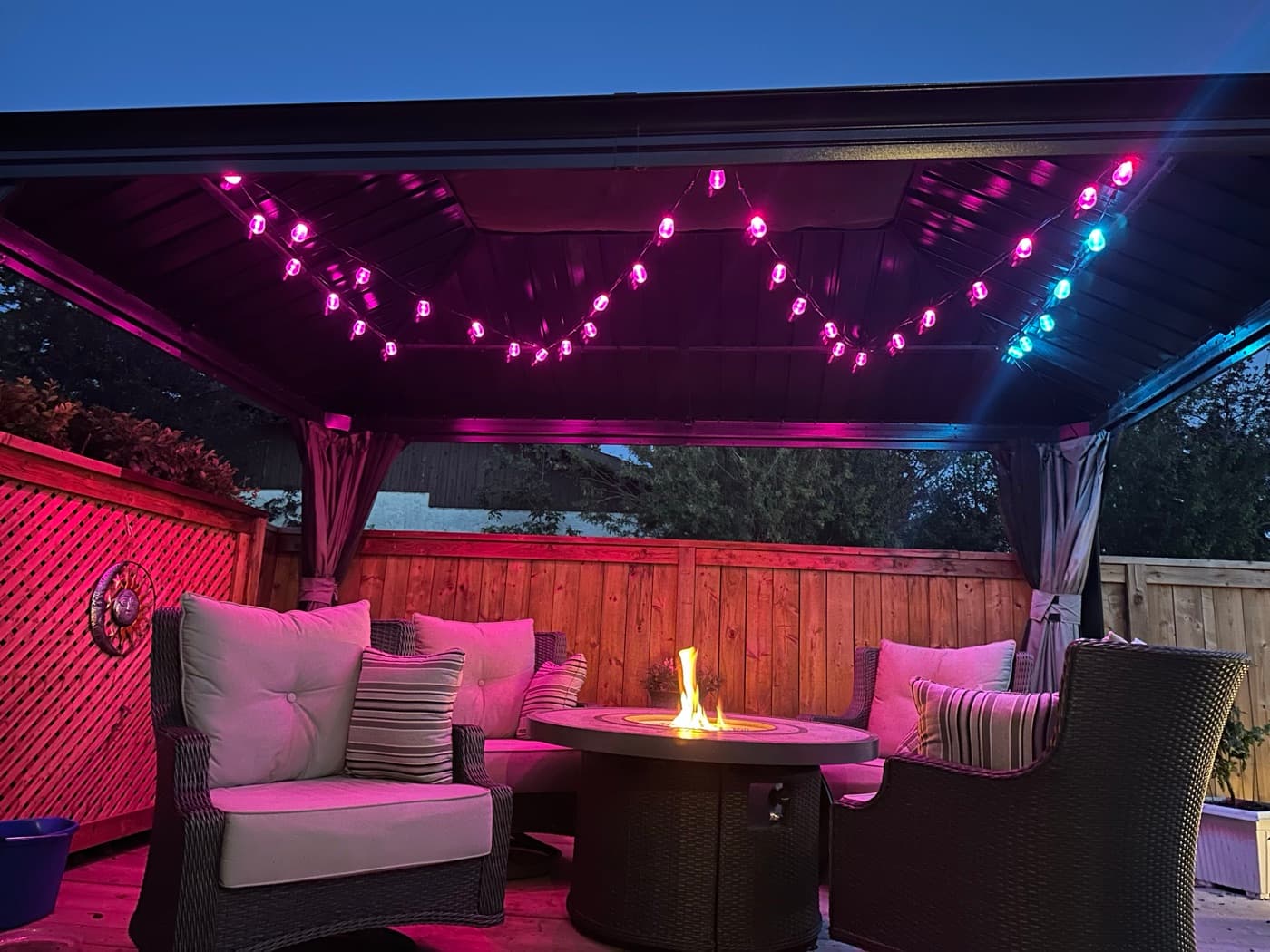 Patio party mode — magenta and teal permanent lighting