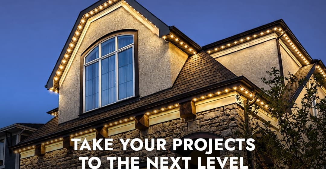 Warm white Watts soffit lighting on a stone-and-stucco home at dusk